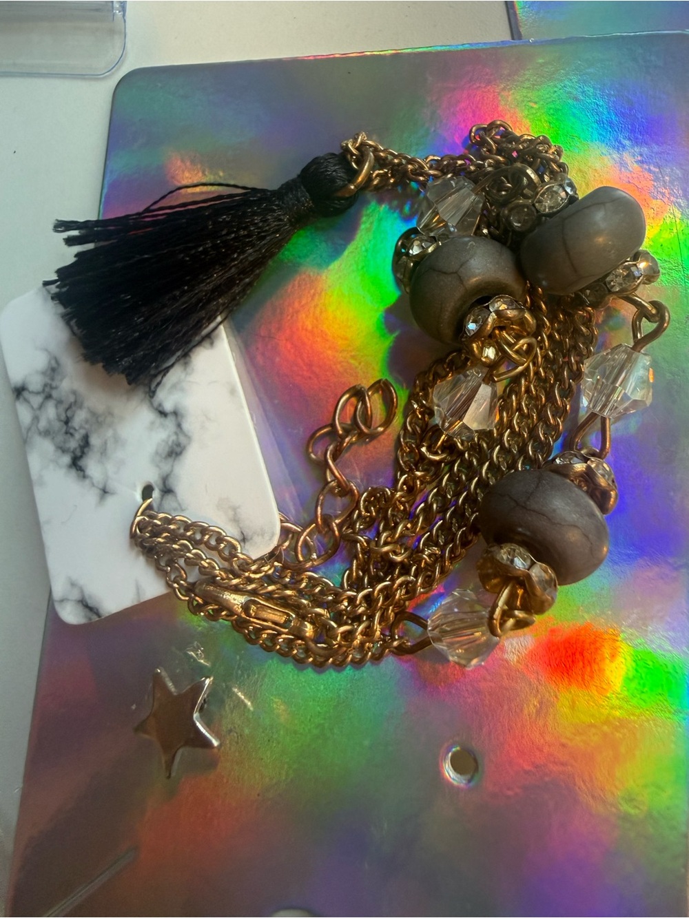Gold-Tone Chain Bracelet with Gray Beads and Black Tassel